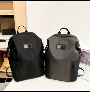 Minimalist waterproof men's backpacks in black and grey with wave pattern label detail
