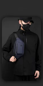Detail showing the smart storage space and premium nylon fabric of the men's navy chest bag