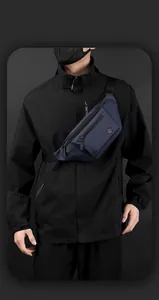 Detail view of water-resistant navy blue crossbody chest bag with adjustable strap