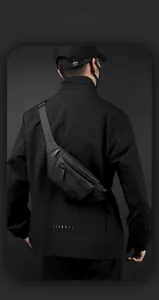 Detail of waterproof black crossbody chest bag showing layered zipper structure and texture