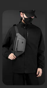 Detail of gray waterproof chest bag showing matte fabric texture and zipper pocket