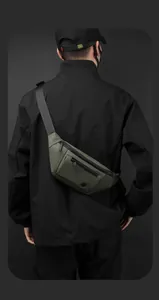 Detail showing the smart storage space of an olive green waterproof outdoor chest bag