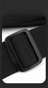 Detail of durable nylon shoulder strap and plastic adjustment buckle on black chest bag
