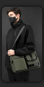 Detail of army green nylon crossbody bag with functional multi-pockets and wide strap