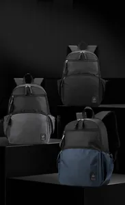 Close-up of waterproof fabric and multi-layer zippers on a professional business backpack