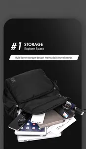 Internal view of black multi-layer travel backpack showing large storage for laptop and camera