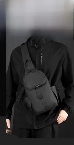 Minimalist black waterproof nylon chest bag for men with adjustable shoulder strap