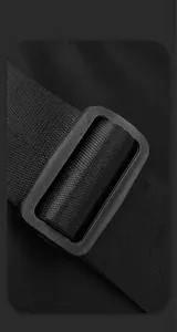 Macro shot of durable nylon shoulder strap and matte plastic buckle on black backpack