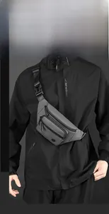 Close-up of grey casual chest bag featuring three zip compartments and nylon strap