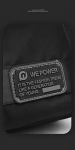 Close-up of durable black nylon fabric with a premium molded rubber logo tag on the bag