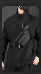 Close-up of black tactical chest bag showing matte fabric texture and zipper compartments