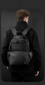 Close-up of durable black business backpack with waterproof oxford fabric and reinforced straps