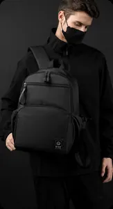 Side view of black water-resistant business backpack with multi-layer zipper compartments
