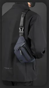 Detail of navy blue multifunctional sling bag with adjustable strap and plastic buckle