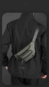 Olive green waterproof chest bag with dual zippers and adjustable strap for outdoor travel