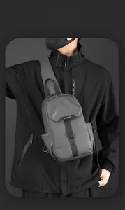 Close-up of waterproof nylon crossbody bag featuring magnetic buckle and textured fabric
