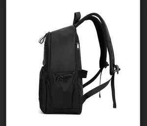 Side view of black business backpack with breathable mesh straps and durable nylon material