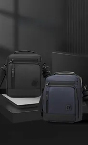 Detail of waterproof nylon shoulder bags with multi-pocket layout in black and navy