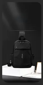 Close-up of black waterproof chest bag featuring side elastic pocket and metal zippers