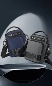 Waterproof nylon crossbody bag in navy blue and dark grey with adjustable strap