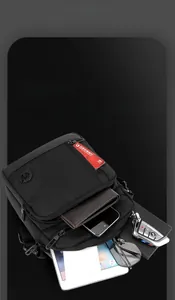 Detail of waterproof nylon crossbody bag showing spacious interior for tablet and daily items