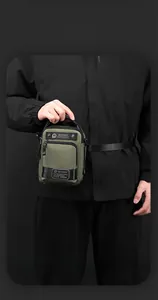 Olive green waterproof nylon waist bag for men featuring compact design and WEPOWER label