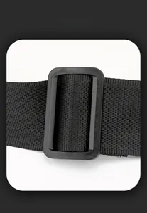 Detail of adjustable matte black plastic buckle on a durable nylon webbing shoulder strap