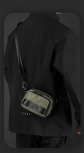Detailed view of green nylon crossbody bag with black buckle and WEPOWER logo label