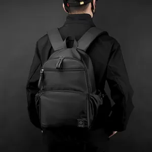 Classic black business travel backpack with ergonomic straps shown from a rear back view