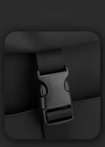 Detail of durable black nylon fabric and heavy-duty plastic buckle for chest bag