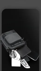 Detail view of water-resistant nylon crossbody bag with phone, wallet and keys storage