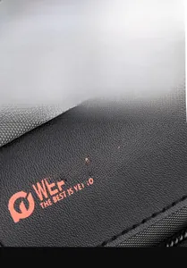 Detail of WEPOWER logo on black outdoor crossbody bag with premium leather texture
