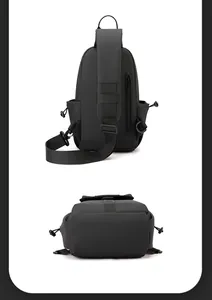 Detail view of the black chest bag back with padded strap, zipper pocket and D-ring