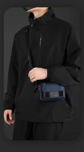 Detail of navy blue crossbody bag with adjustable strap and WE POWER logo badge