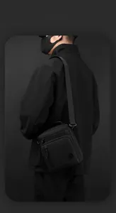 Men's waterproof shoulder bag with smart storage space and adjustable strap for business