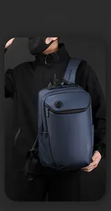Close-up of waterproof matte texture and hidden zipper on dark blue business backpack