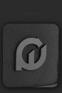 Close-up of modern matte rubber logo and durable woven nylon texture on black backpack