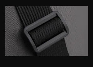 Detail of durable nylon shoulder strap with adjustable plastic buckle on a waterproof bag