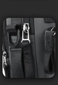 Macro detail of waterproof fabric, metallic zipper, and D-ring on casual crossbody bag