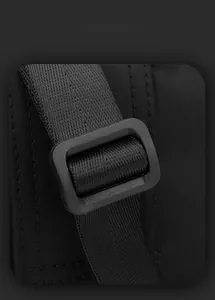 Macro shot of durable black plastic buckle and high-density woven shoulder strap texture