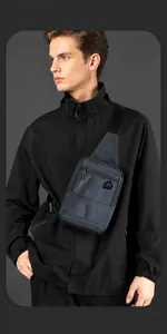Close-up of a navy blue water-resistant chest bag with logo detail on a male model