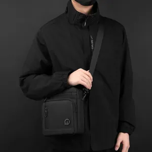 Waterproof black nylon crossbody bag for men featuring adjustable strap and multi-zipper pockets
