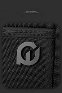 Detail of durable nylon fabric texture and matte geometric logo on the black chest bag
