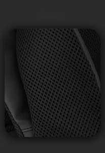 Macro detail of the breathable honeycomb mesh fabric and durable synthetic fiber of the backpack