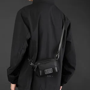 Modern black mini crossbody bag in waterproof nylon with adjustable shoulder strap