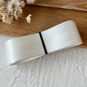 Textured white striped ribbon with subtle satin sheen for DIY craft and doll clothing