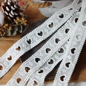 Close-up of white heart-shaped water-soluble lace ribbon for DIY sewing projects