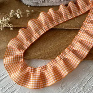 Pleated orange and white gingham ruffle trim for DIY hat making and sewing projects