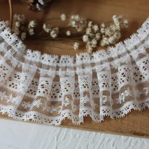 White ruffled eyelash lace trim with floral embroidery for DIY clothing and crafts