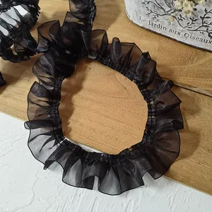 Detail of 4cm black pleated organza lace trim with ruffled edges for garment sewing